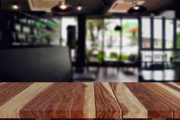 istock wood table top in coffee shop blank for design 1140081515