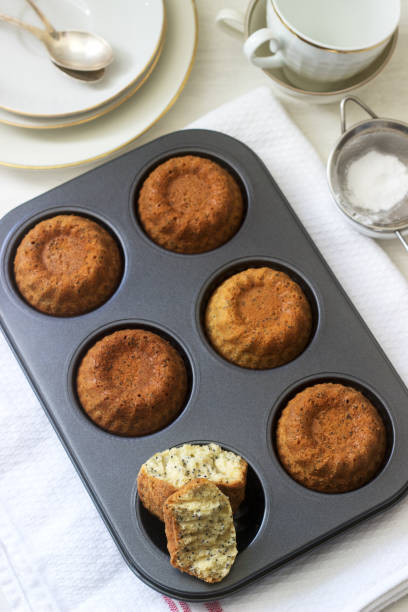 istock Lemon poppy biscuit muffins for tea on a light background. 1140082232