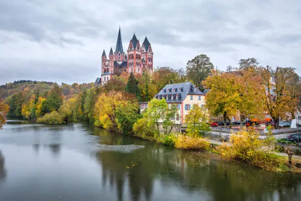 Autumn cityscape of Limburg an der Lahn with river and Limburg Cathedral, Hesse, Germany