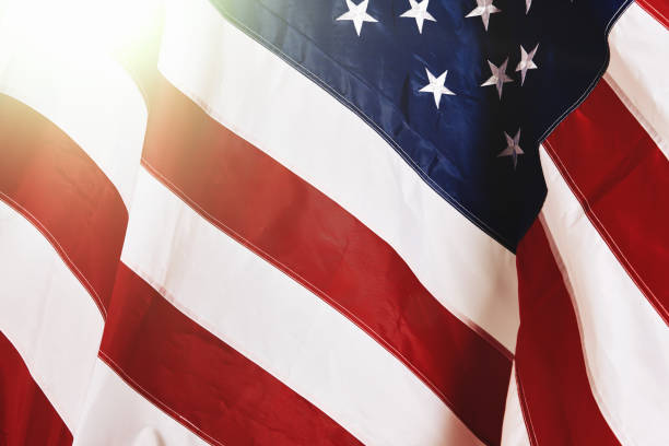 istock Cropped, folded Stars & Stripes flag rippling in breezy sunshine 1140093104