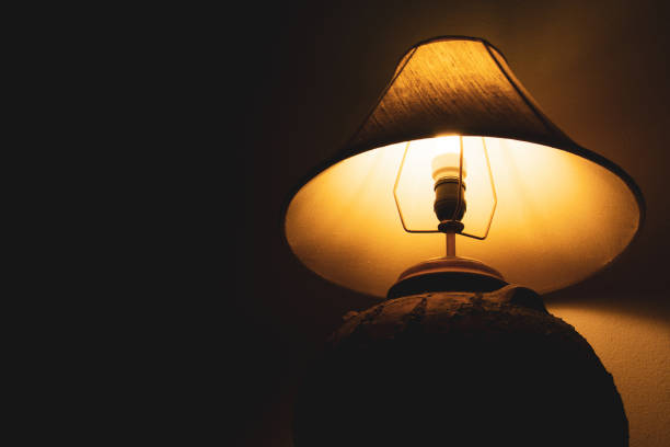 istock Livingroom lamp at night with dark background 1140095555