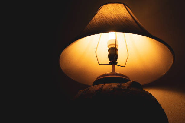 istock Livingroom lamp at night with dark background 1140095560