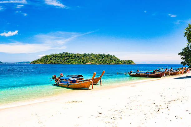 istock Long tail boat on tropical beach, Andaman Sea Thailand 1140095567
