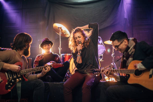 istock Modern music band performing on stage in nightclub 1140096076