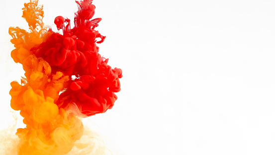 Bright colors explosion, fire. Red, orange and yellow smoke on white background, panorama with copy space