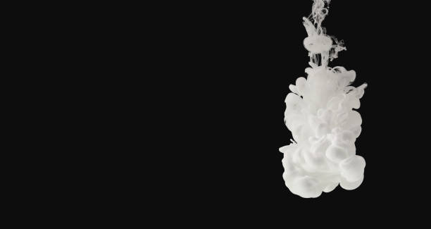 istock White paint flowing in water isolated on black 1140097077