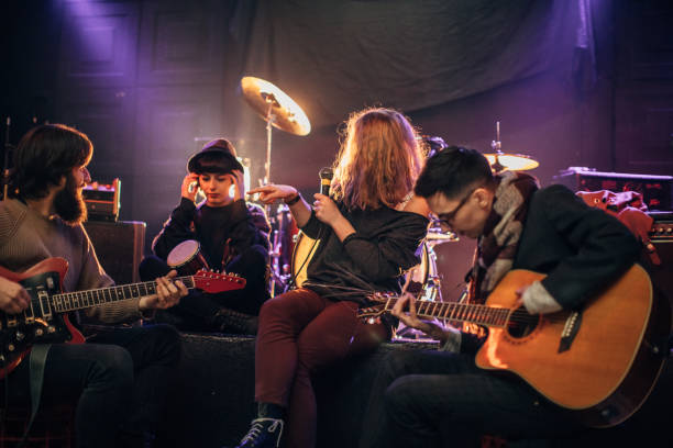 istock Band having fun performing on stage in nightclub 1140097225
