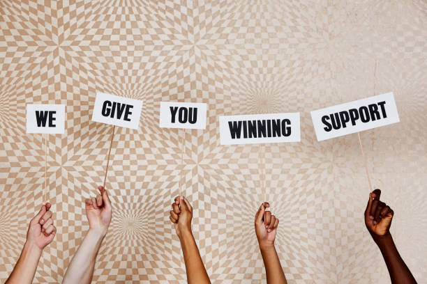 istock Five raised hands with signs 
