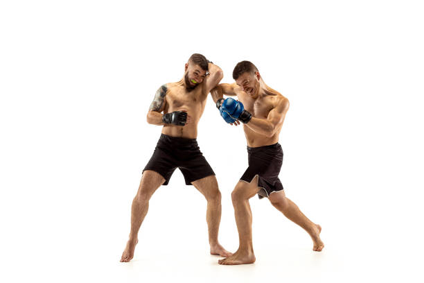 istock Two professional boxers boxing isolated on white studio background 1140102779
