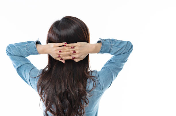 istock Rear view of woman hands behind head 1140103199