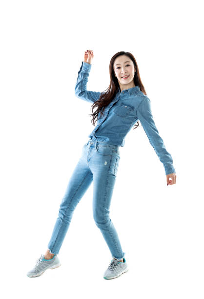 istock Excited woman jumping on white background 1140104113