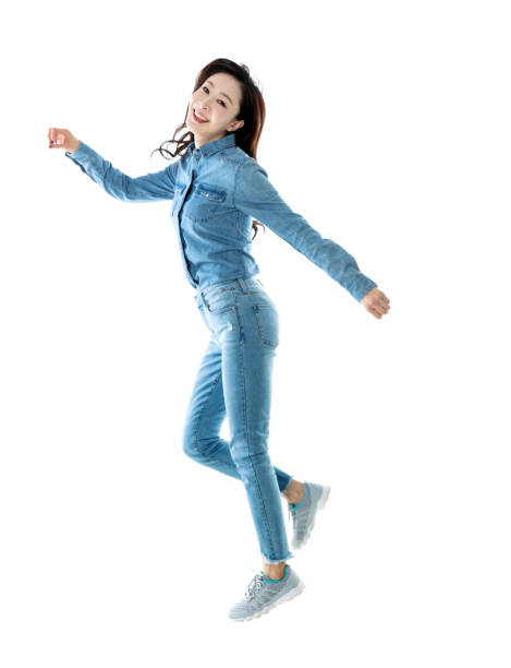 istock Excited woman jumping on white background 1140104287