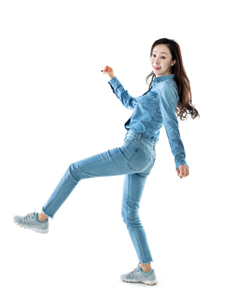 istock Excited woman jumping on white background 1140104541