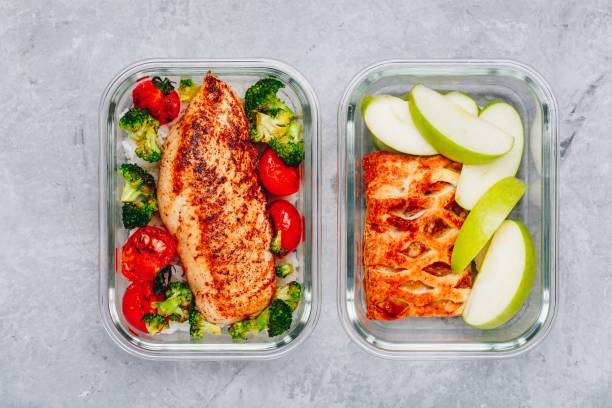 istock Grilled chicken meal prep containers with rice, broccoli and tomatoes and dessert pie with green apple 1140104763