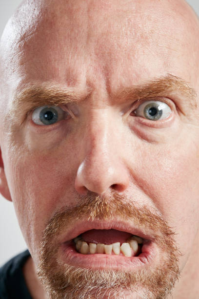 istock Horrified man gasps in shock 1140106070