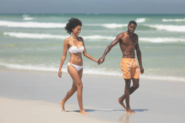 istock Couple walking with hand in hand at beach 1140106981