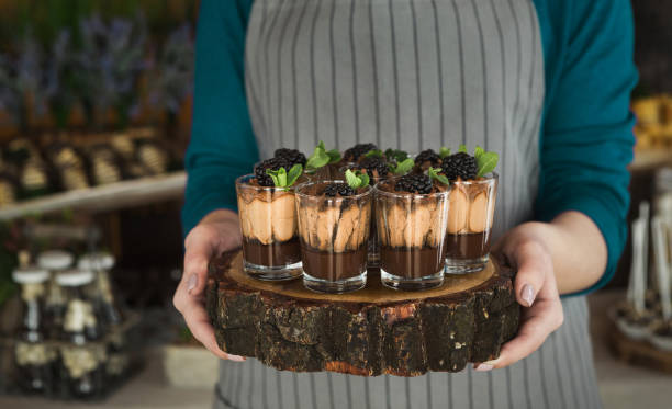 istock Chef holding chocolate dessert with blackberry 1140109681