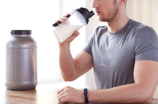 istock close up of man drinking protein shake 1140110561