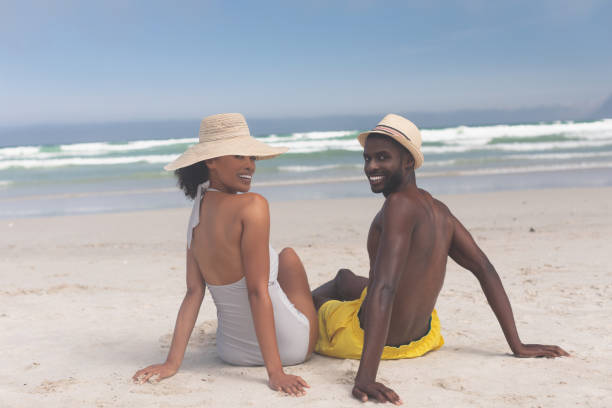 istock Couple relaxing at beach on a sunny day 1140111534