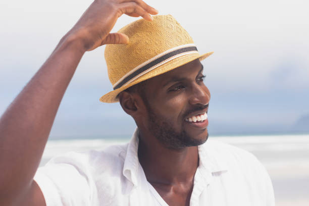 istock Man standing at beach on a sunny day 1140111656