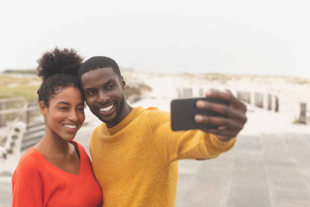 istock Romantic couple taking selfie near promenade 1140113667