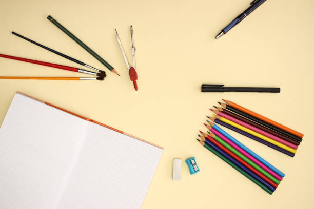 istock School and art supplies on yellow background 1140113669