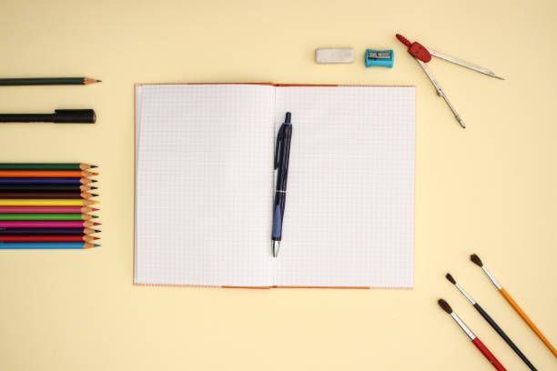 istock School and art supplies on yellow background 1140113877