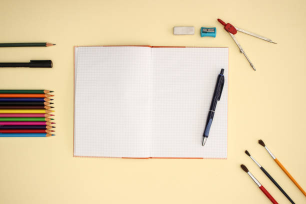 istock School and art supplies on yellow background 1140113890