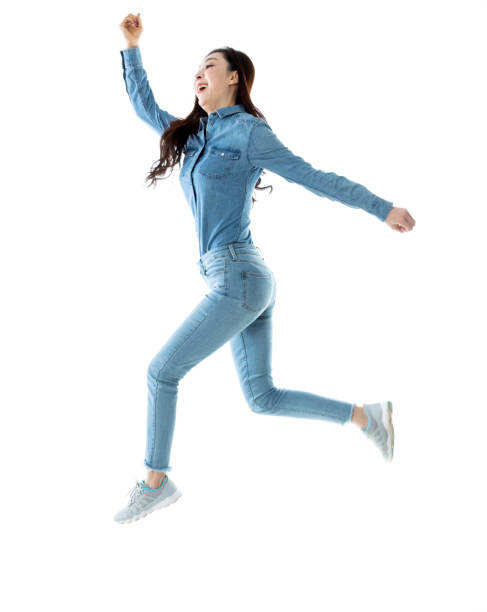 istock Excited woman jumping on white background 1140114059