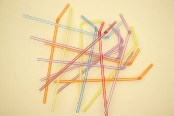 istock Plastic colorful tube on yellow background 1140114069
