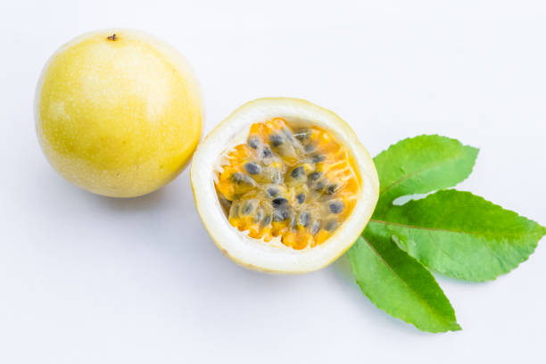 passion fruit passion fruit isolated on white background passion fruit flower stock pictures, royalty-free photos & images