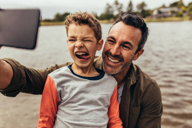 istock Father and son taking a selfie 1140117941