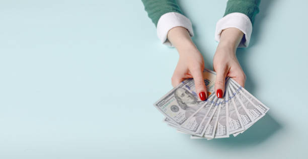 istock Female hands with cash, euro banknotes. 1140119679