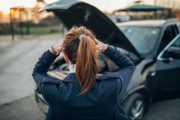 istock Frustrated woman and broken car 1140122376
