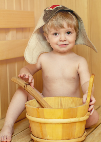 Beauty Healthcare Baby Boy Relaxing In The Sauna Toddler With Broom And Hat  In Russian Sauna Or Bath Stock Photo - Download Image Now - iStock