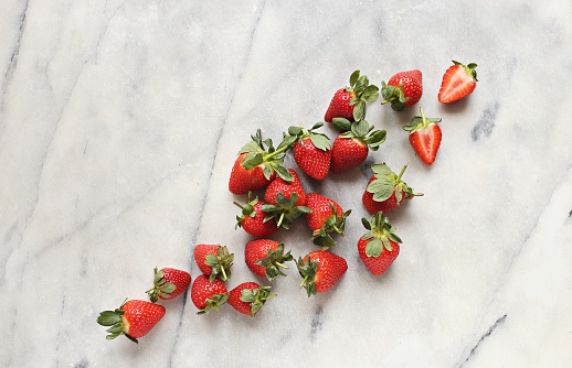 Fresh berries on light marble background. Overhead view