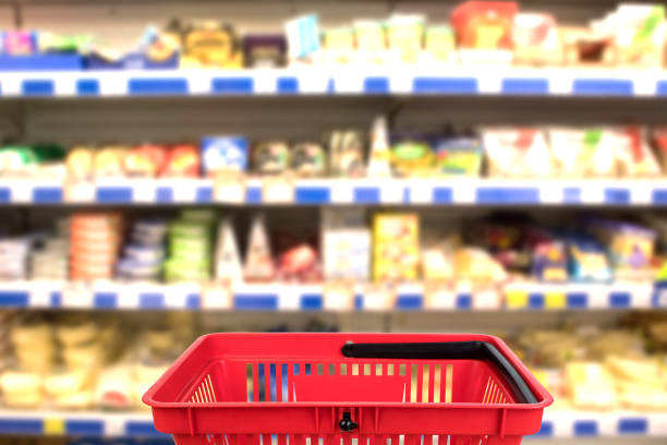 Abstract blurred photo of store with basket in department store bokeh background. business concept. stock photo