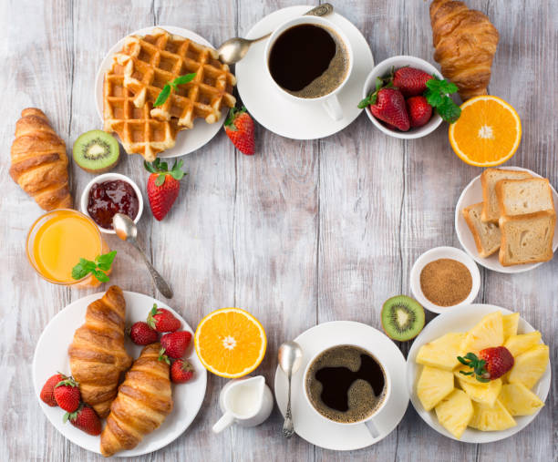 istock Continental breakfast table with coffee, orange juice, croissants 1140123892