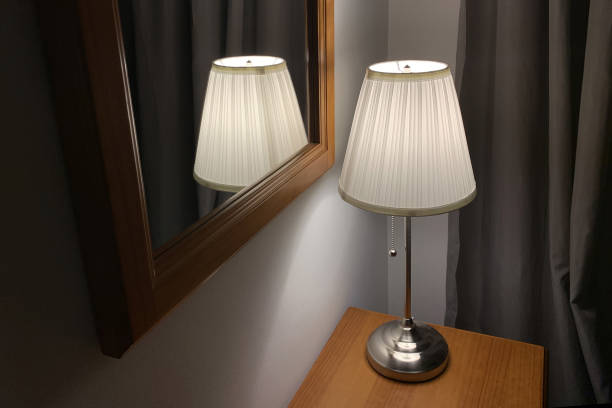 table lamp with lampshade on a wooden table