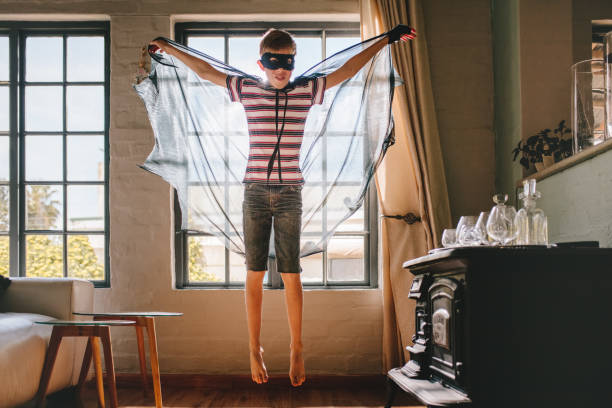 istock Boy in bat costume at home 1140126102