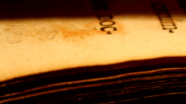 4K Old book flipping pages macro shots