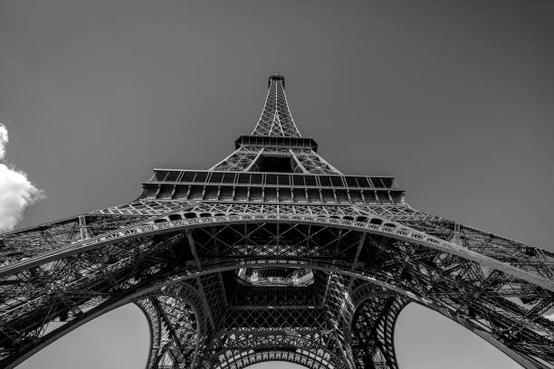 Eiffel tower against blue sky at morning. Photo made from pedestrian point of view. No people around