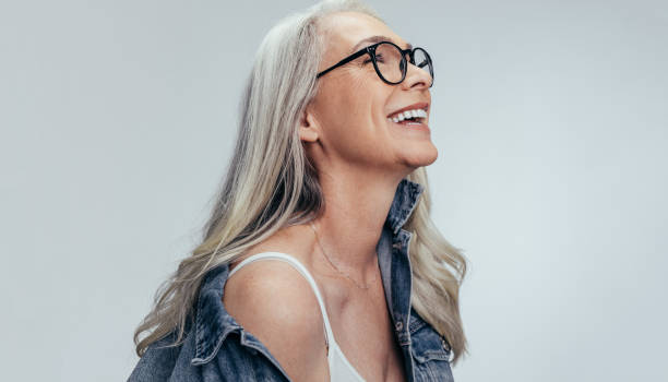 istock Cheerful senior woman looking at copy space 1140127222
