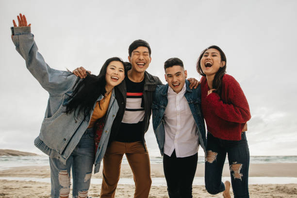 istock Friends having great time together at the beach 1140128339
