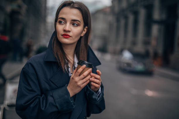 istock Charming woman with takeaway coffee 1140129496