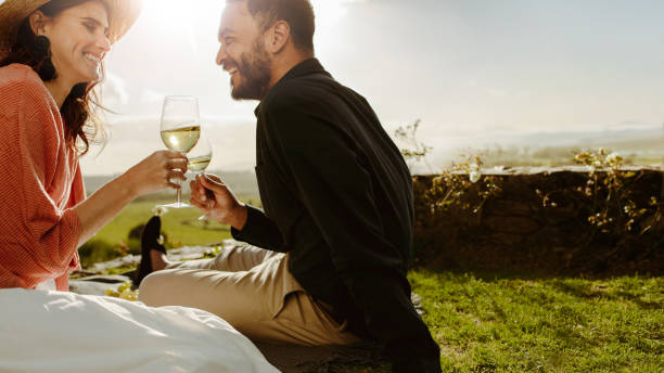 istock Couple on a date near a wine farm drinking wine 1140131965