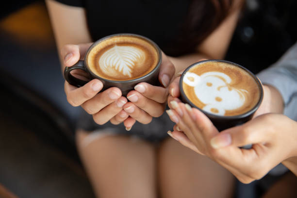 istock Female hands holding cups of coffee. 1140131978
