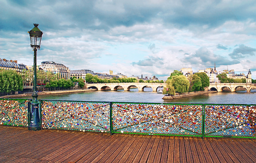Pont des Arts, which is a pedestrian bridge, is located near the Ile de la Cité, in the heart of the city. Made of cast iron and with 7 arches, it is the replica of an old bridge damaged by boats and bombings. Today, the tradition is that lovers hang a padlock with their initials to seal their love.