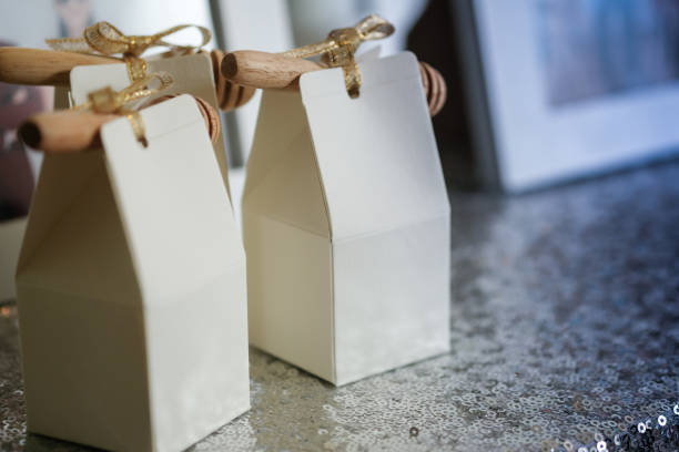 Honey in packets with wooden stick, cute souvenirs wedding