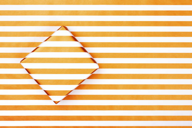 istock Top view of gift box on striped paper. 1140135429